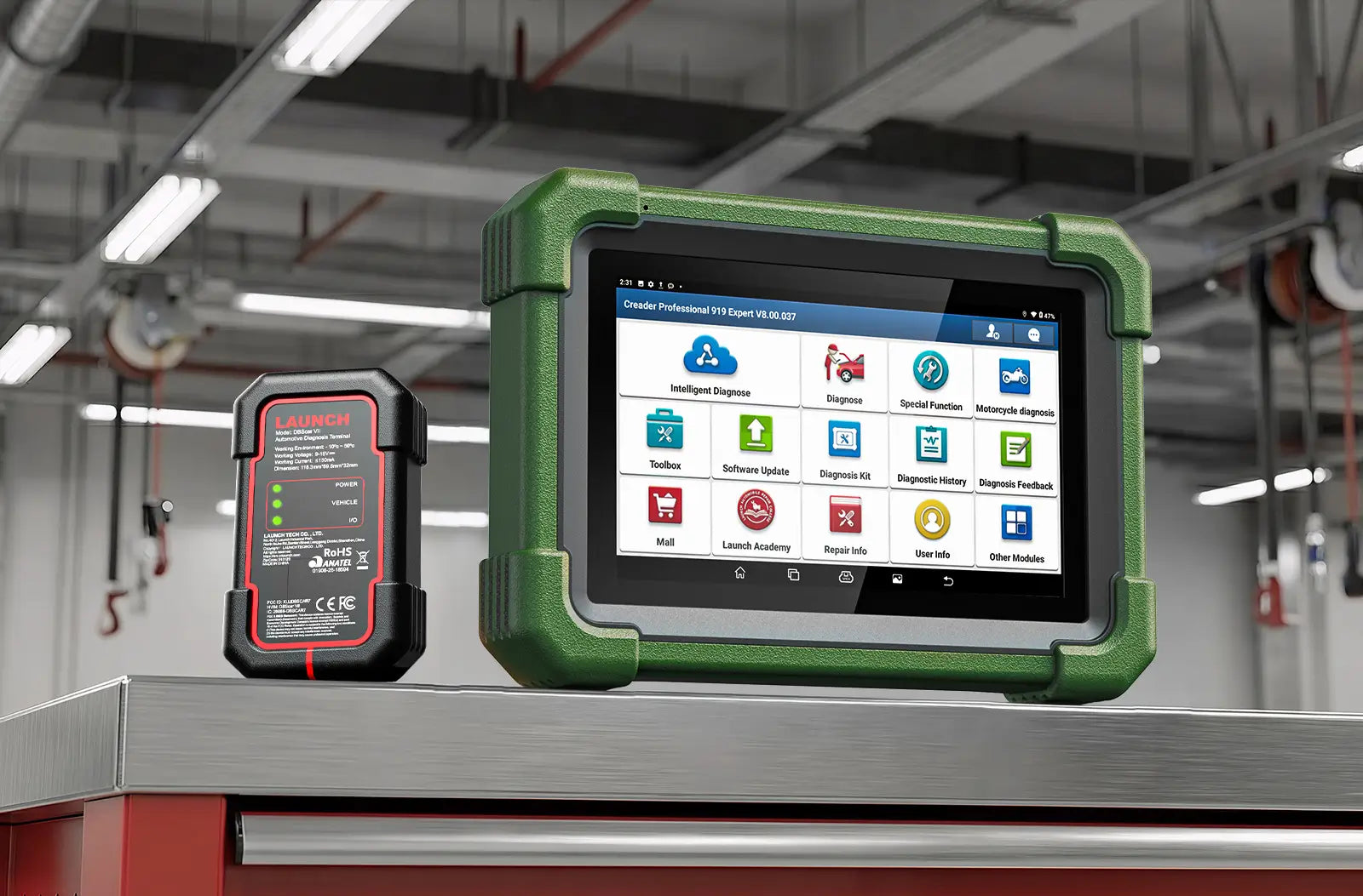 A LAUNCH Creader Professional 919 Expert diagnostic scanner enclosed in a rugged orange protective bumper, sitting on a metallic workshop surface. It is positioned next to a black wireless VCI connector.