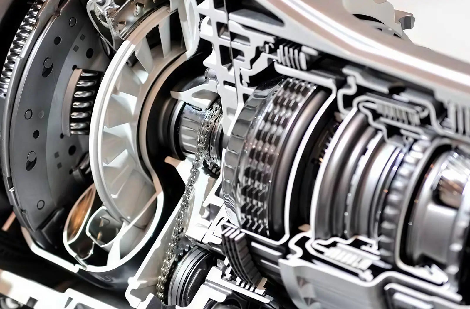Shows a technician's hand checking fluid levels with a dipstick over an open car engine bay, alongside a professional automotive diagnostic tablet showing live graphs.